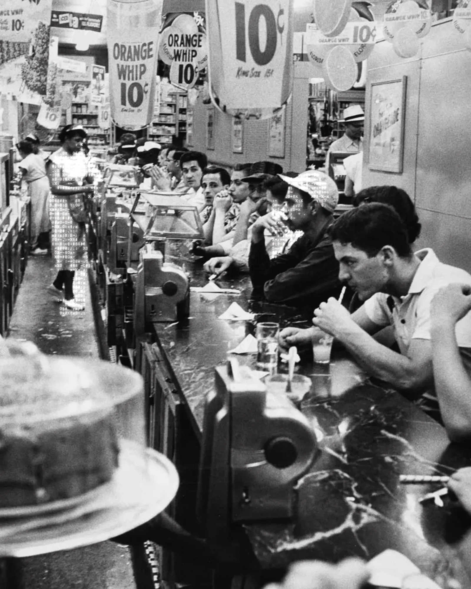 Guests sit along a crowded mid-century lunch counter