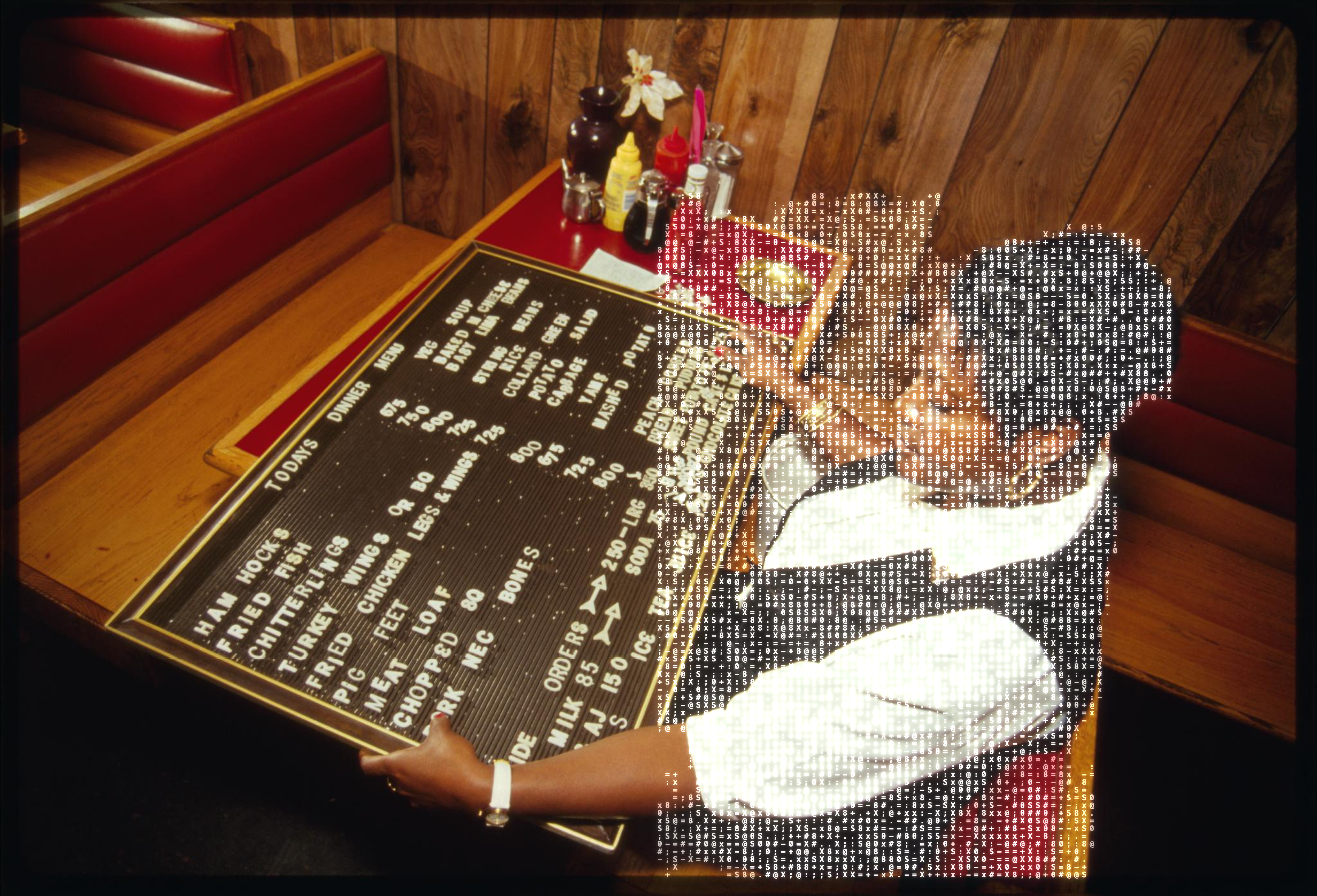 Gladys Prior arranges a restaurant menu board, Paterson, New Jersey, 1994