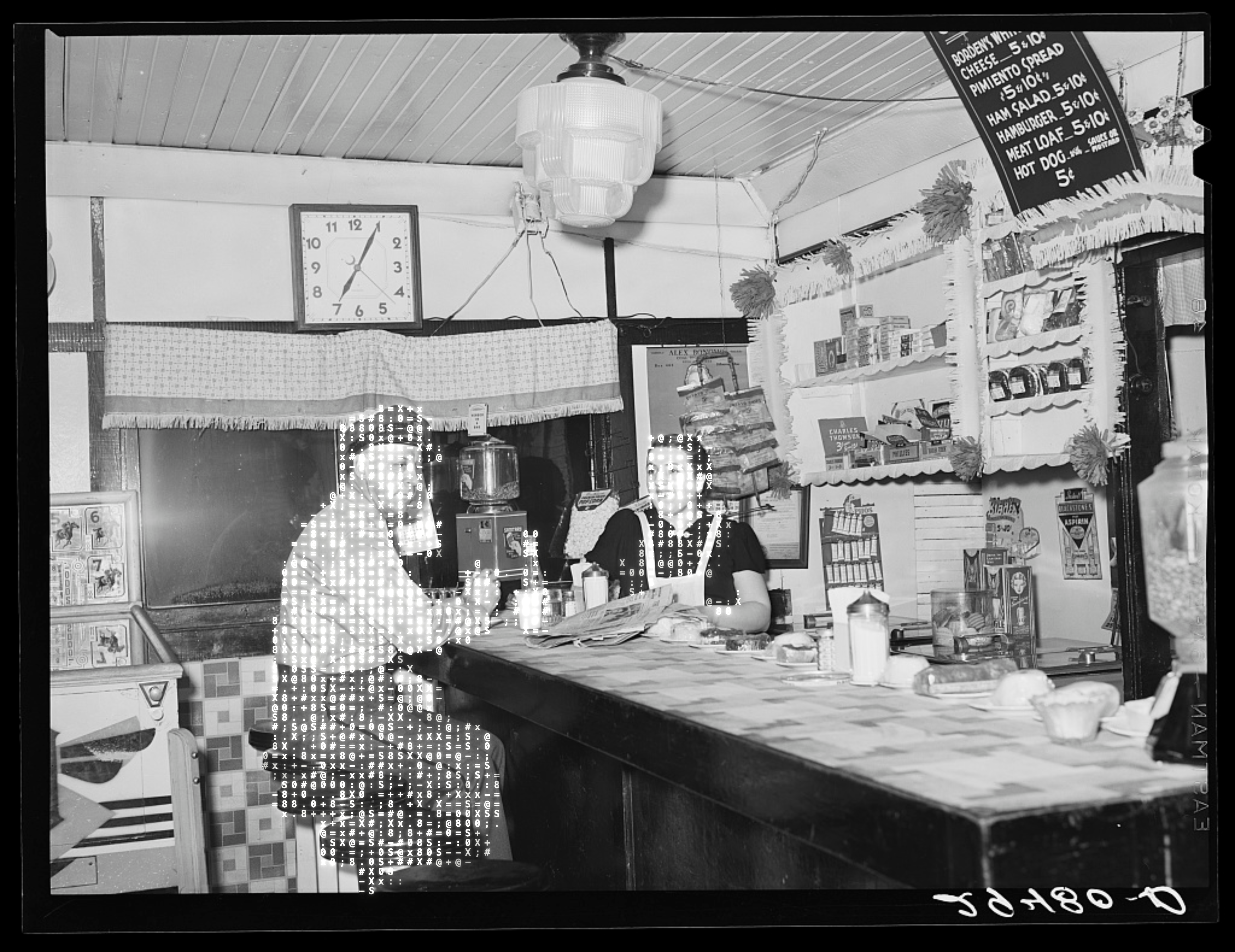 A waitress talks with a truck driver at a diner in Clinton, Indiana, 1940